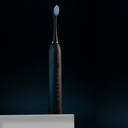 TeethMate black toothbrush unboxed with 4 heads and USB charger