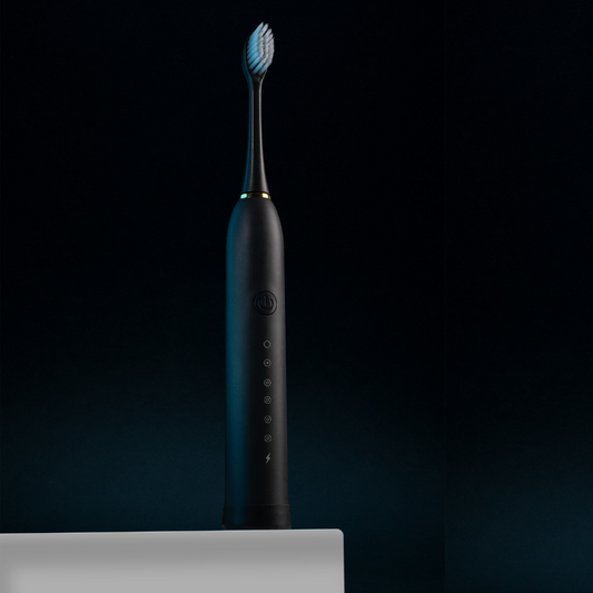 TeethMate black toothbrush unboxed with 4 heads and USB charger